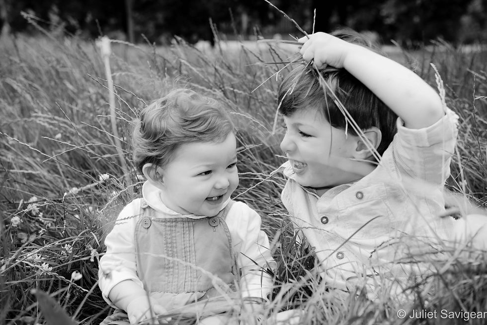 Children Playing In The Grass