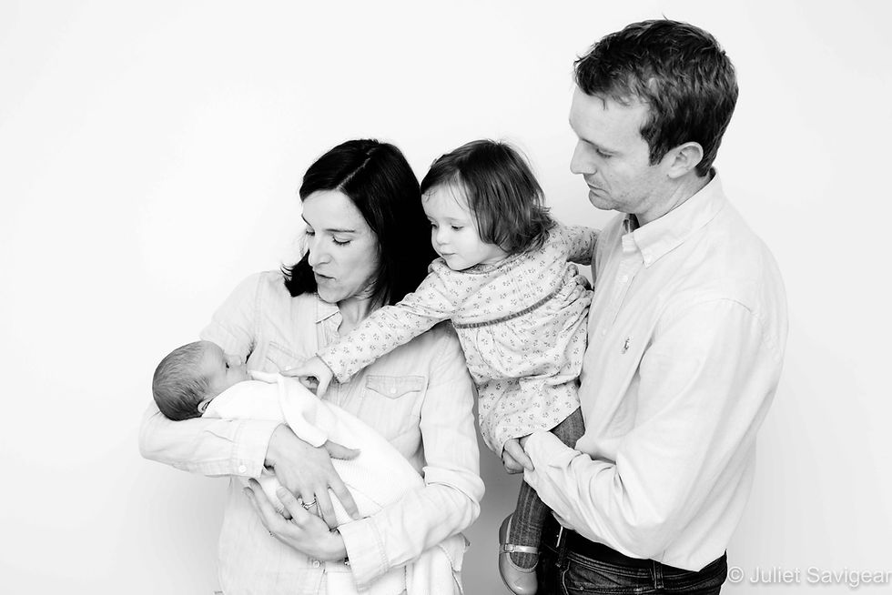Family photo with toddler and newborn baby