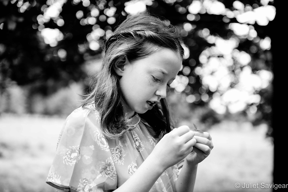 Child playing with leaves