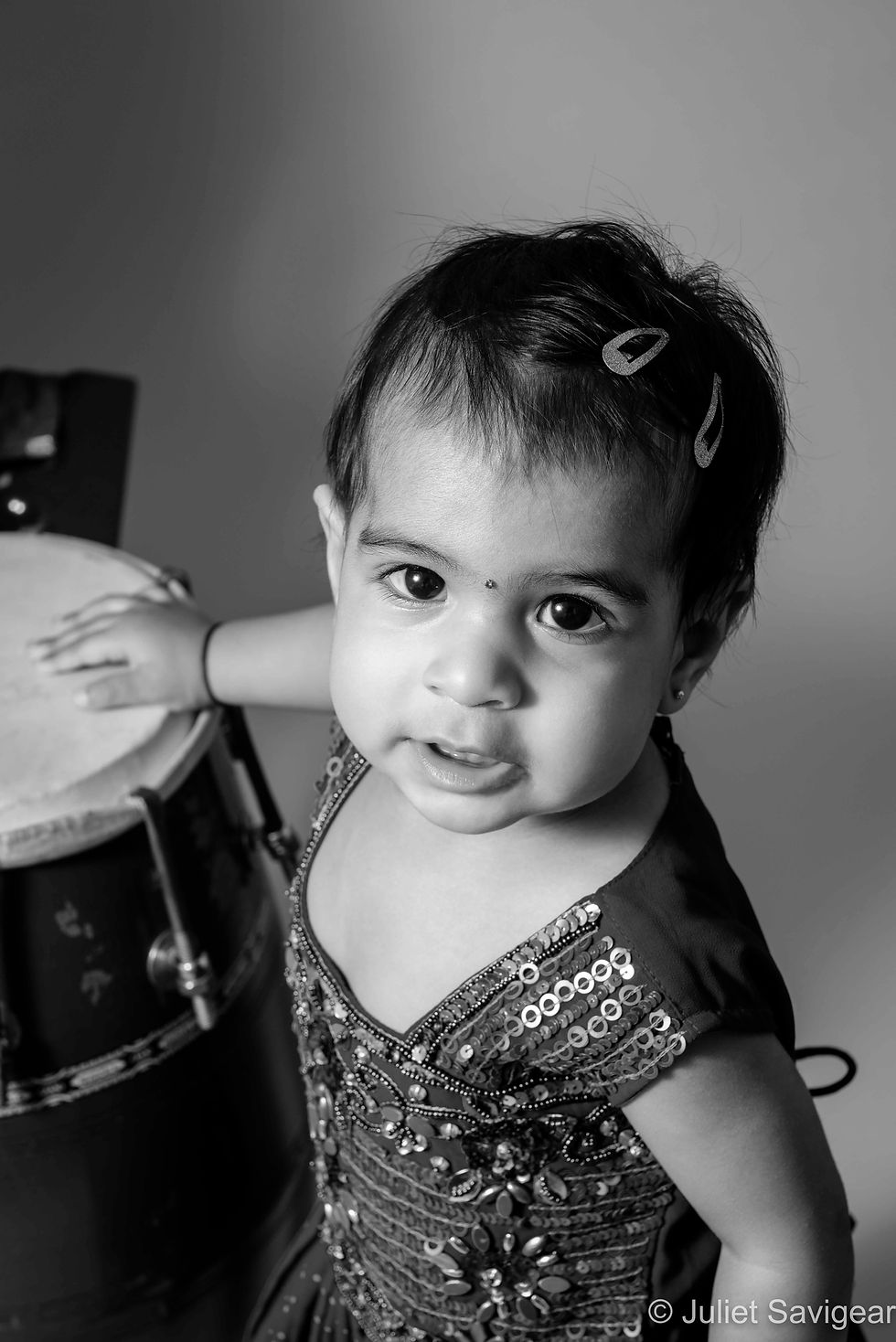 Baby by Indian drum