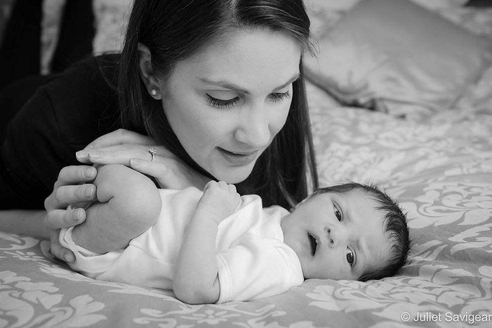 Mother & Baby On Bed