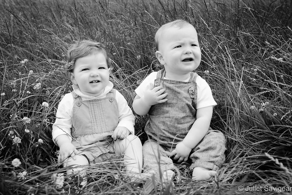Twin Babies In The Grass