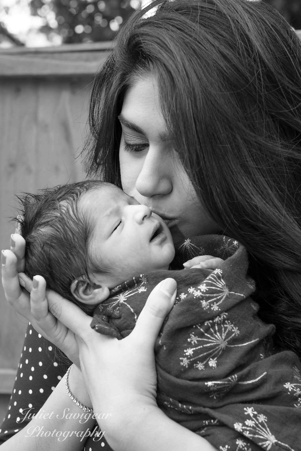 Mummy kissing newborn baby - photo shoots at home - Balham