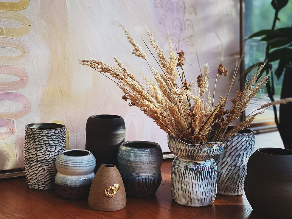 A selection of hand made pottery vases