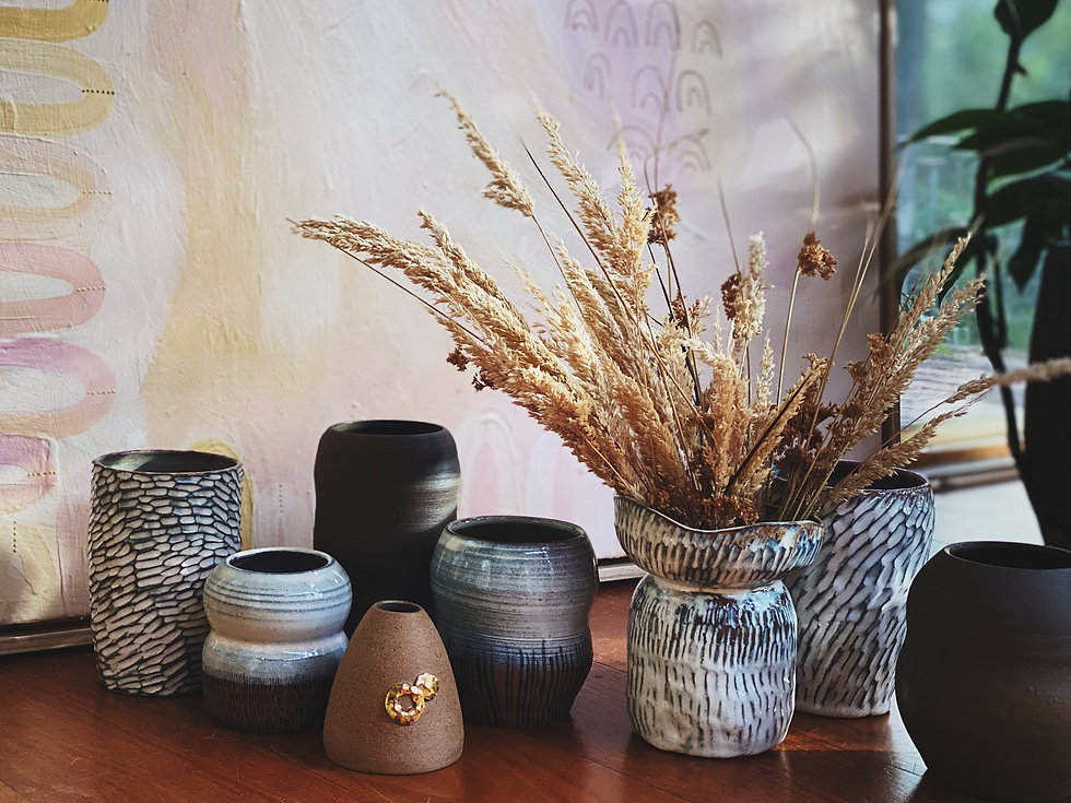 A selection of hand made pottery vases