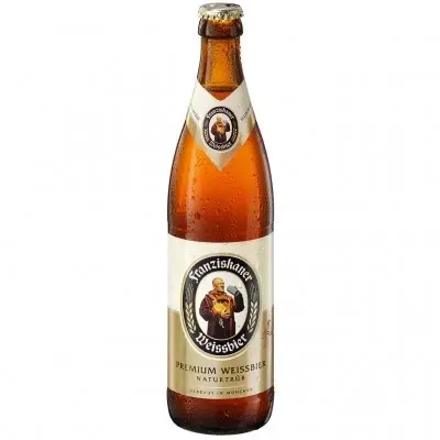 בקבוק Franziskaner Hefe-Weissbier לצד כוס בירת חיטה גבוהה ומלאת קצף.