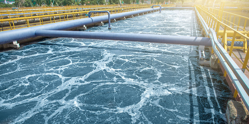 A large wastewater treatment basin with frothy water. Wastewater recycling is no longer a futuristic concept but a present-day necessity.