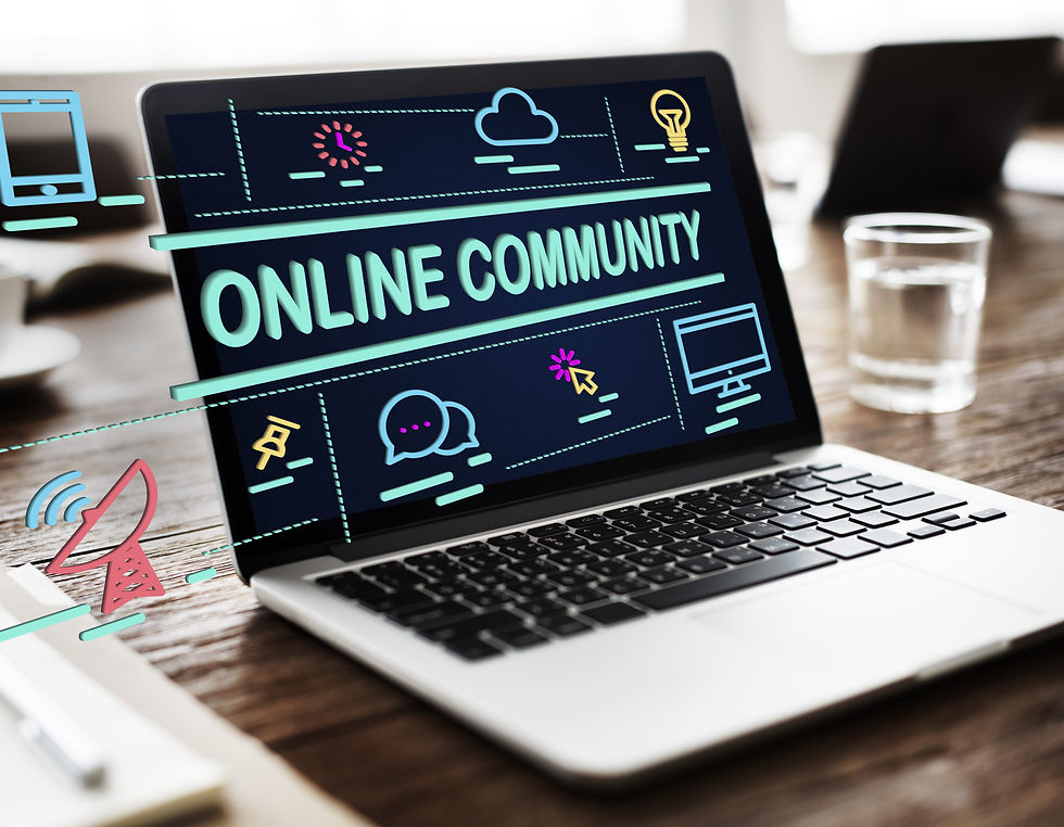Laptop on a wooden desk displaying the words "Online Community" surrounded by digital icons representing connection, communication, and technology.