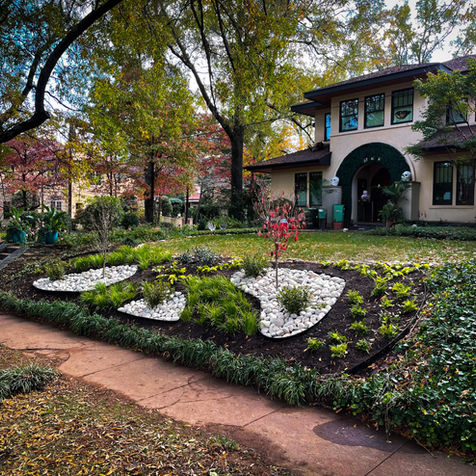 Residential house with landscaped garden and a street view of the neighborhood.