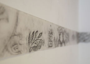 Small graphite rubbings of urban embellishments, with forms like leaves,
birds, fishes, and letters on 4 inch wide tracing paper.