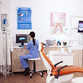 stomatology-office-with-modern-equipment-nurse-wearing-blue-uniform-working-computer.jpg