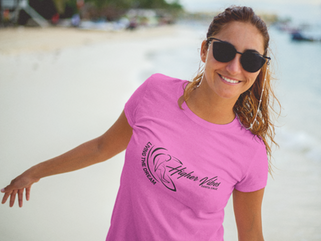 smiling-lovely-woman-wearing-a-t-shirt-mockup-and-sunglasses-at-the-beach-a12725.png