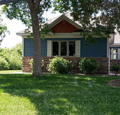 Trim and soffits were sprayed white while the wood shakes were stained with an oil based transparent