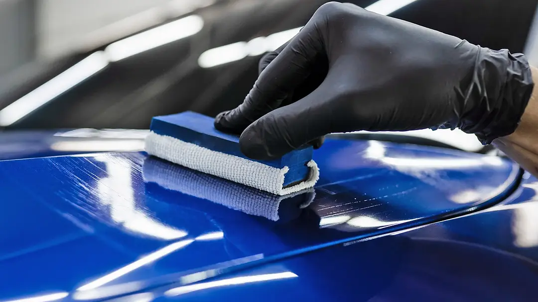 applying-ceramic-coating-to-a-blue-car.webp
