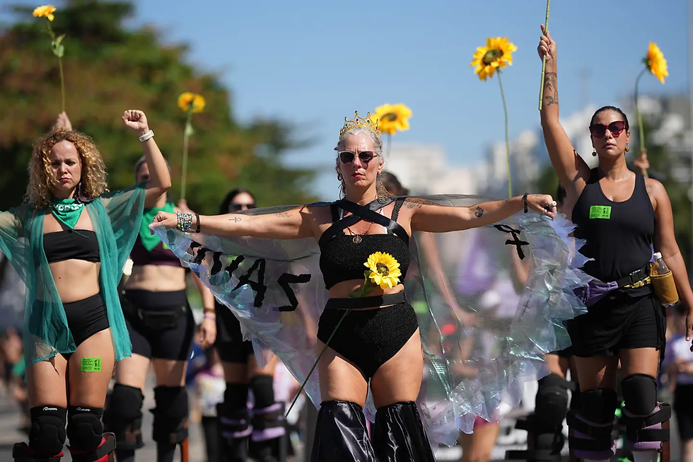 Women protest for stronger laws to combat misogyny and femicide on Copacabana beach in Rio de Janeiro