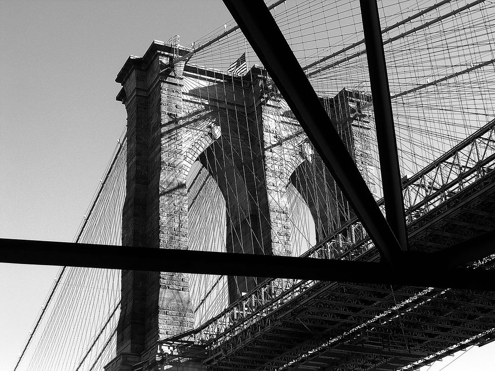 Brooklyn Bridge tower (from the north) in late afternoon sun in black & white, New York, NY