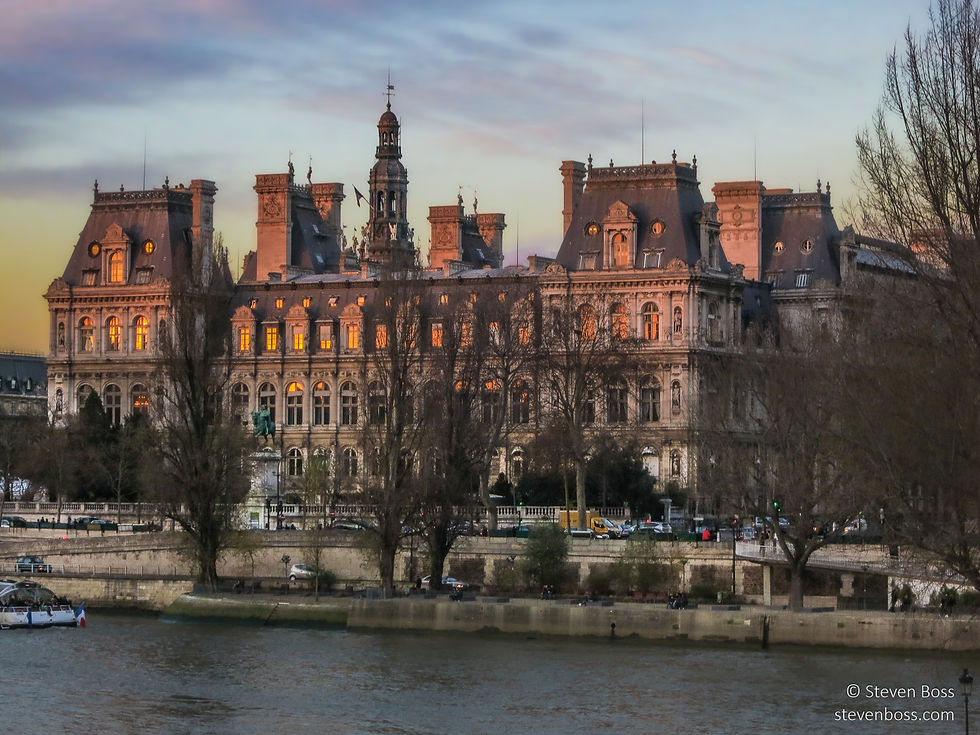 Hôtel de Ville - across the Seine with setting sunlight on the windows, Paris, France
