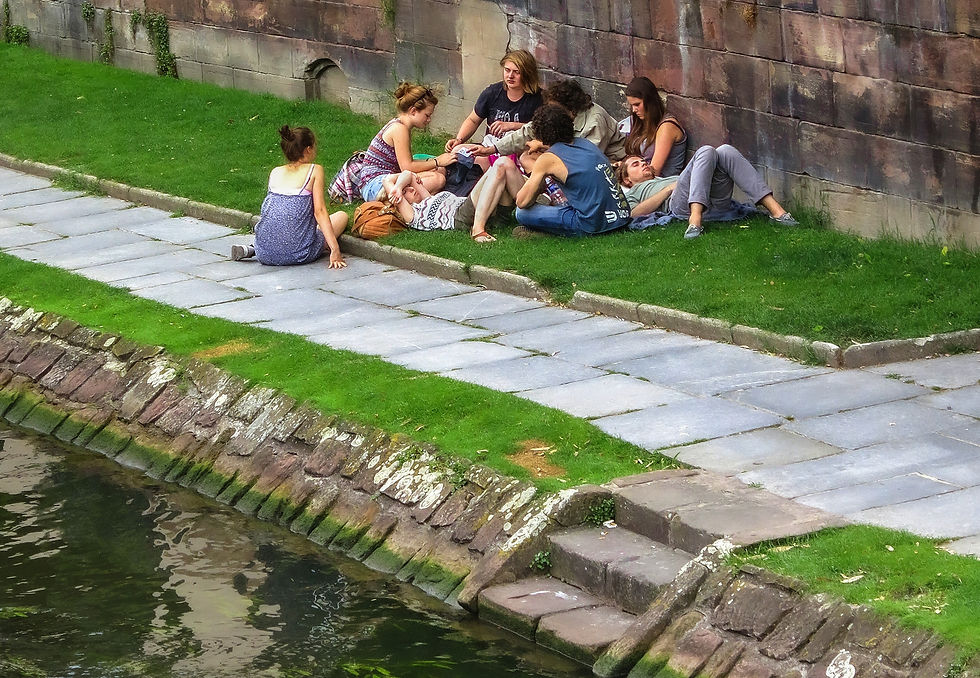 Youth relaxing by the path on the River Ill #2, Strasbourg, France