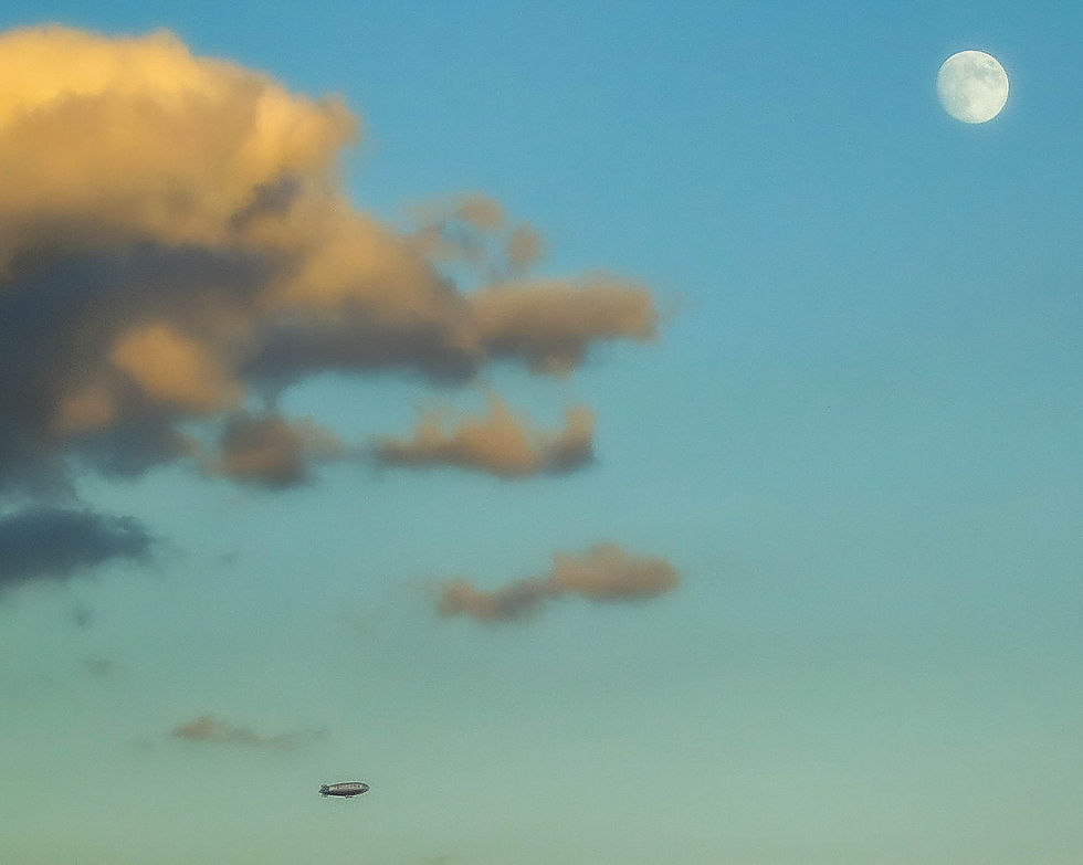 A pretty full moon & the blimp, New York, NY