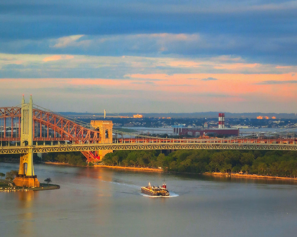 Barge passes under the Triborough Bridge ½ hour before sunset, New York, NY