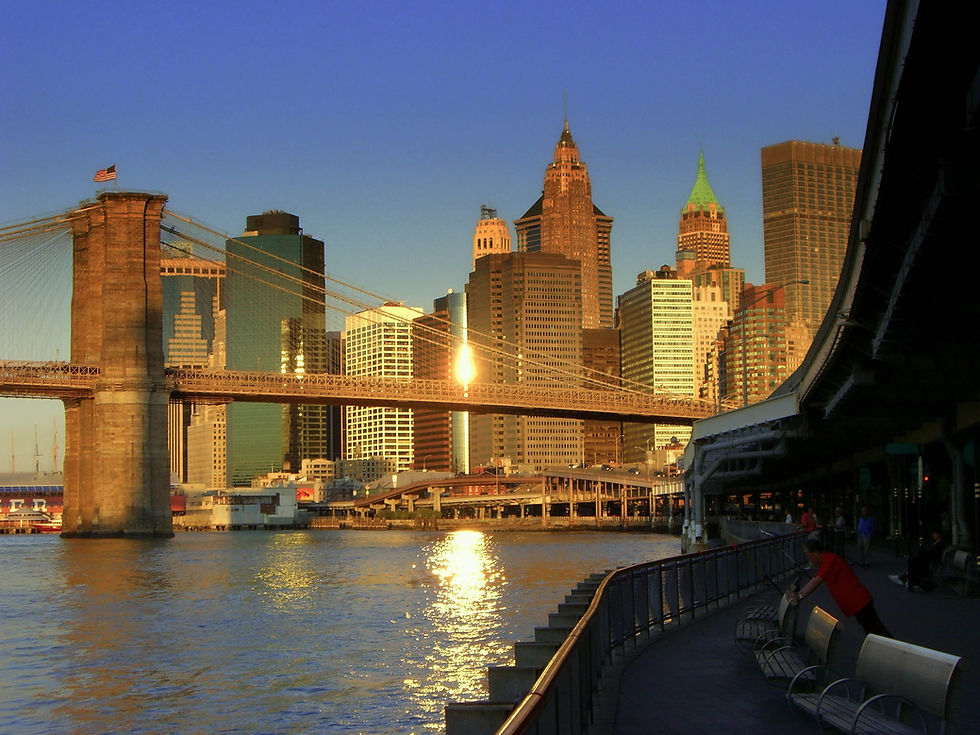 Brooklyn Bridge with lower Manhattan in bright early morning light, New York, NY