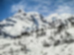 Piz Alv & surrounding mountains covered in snow - from the window of the Bernina Express, Pontresina, Switzerland