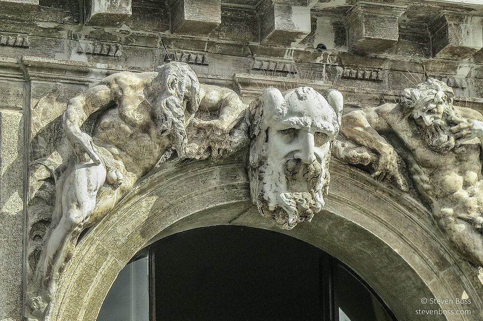 Carved statue detail over the Grand Canal entry to Palazzo Flangini, Venice, Italy