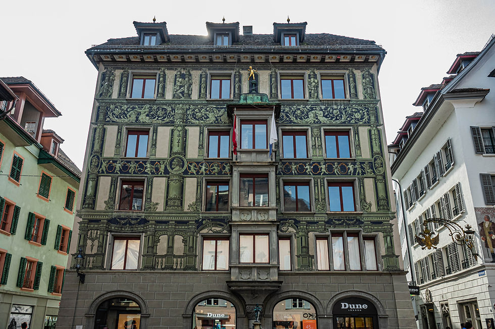 Painted façade: in green with columns, cherubs & gold rings, Lucerne, Switzerland