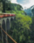 Crossing the Schmittnerbach Viaduct with the Landwasser Viaduct ahead - from the window of the Bernina Express, Filisur, Switzerland