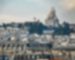 Basilique du Sacré Cœur - a long shot with the Château d'eau Montmartre (water tower) in the left center, Paris, France