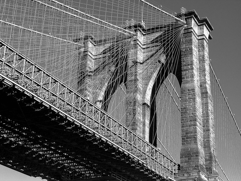Brooklyn Bridge tower (from the south) in late afternoon sun in black & white, New York, NY