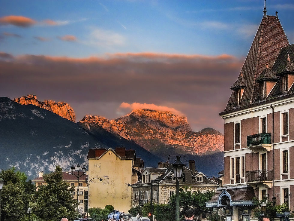 Last of the sun's rays on the cliffs across the lake, Annecy, France