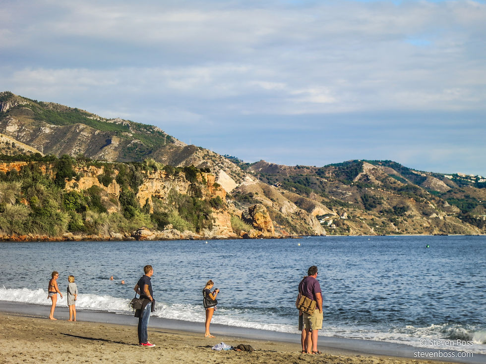 On the beach, staring at the sea, Nerja, Spain