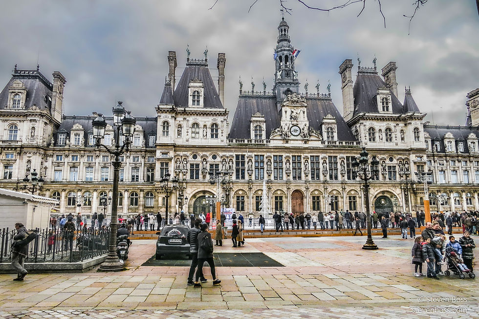 Hôtel de Ville - the west façade & the crowd watching ice skaters on Christmas, Paris, France