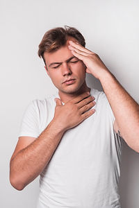 A man having headache and acidity