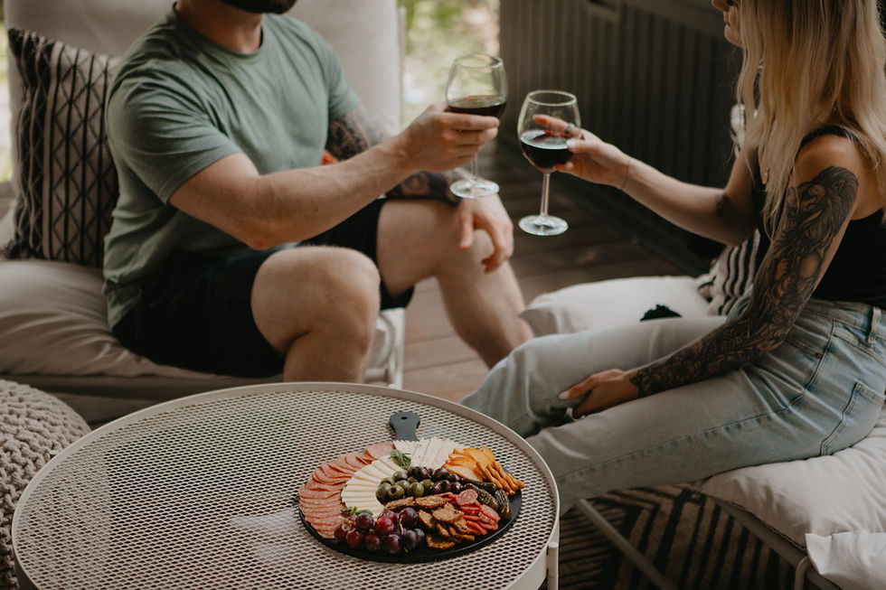 Wine toast over charcuterie at The Wild Haven in Hochatown, Oklahoma