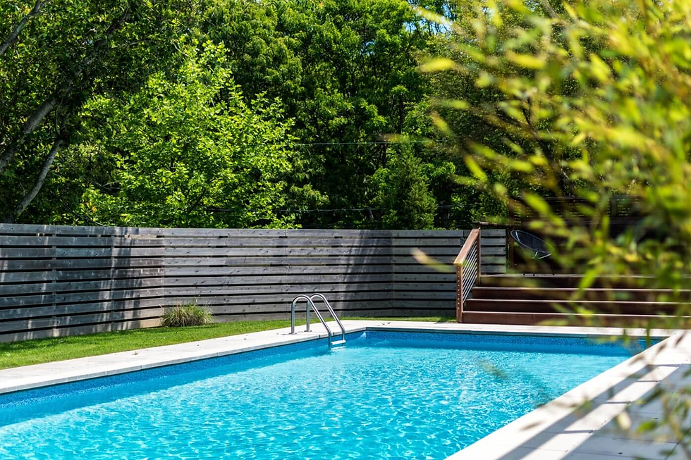 A clean backyard swimming pool in Overland Park representing a pest-free outdoor living space.