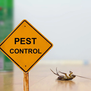 A yellow pest control warning sign, serving as the featured image for the Top 5 Pest Problems Kansas City Homeowners Miss.