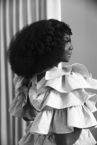 Portrait from Heavy is the Head that Wears the Crown exploring Black hair, identity, and beauty politics