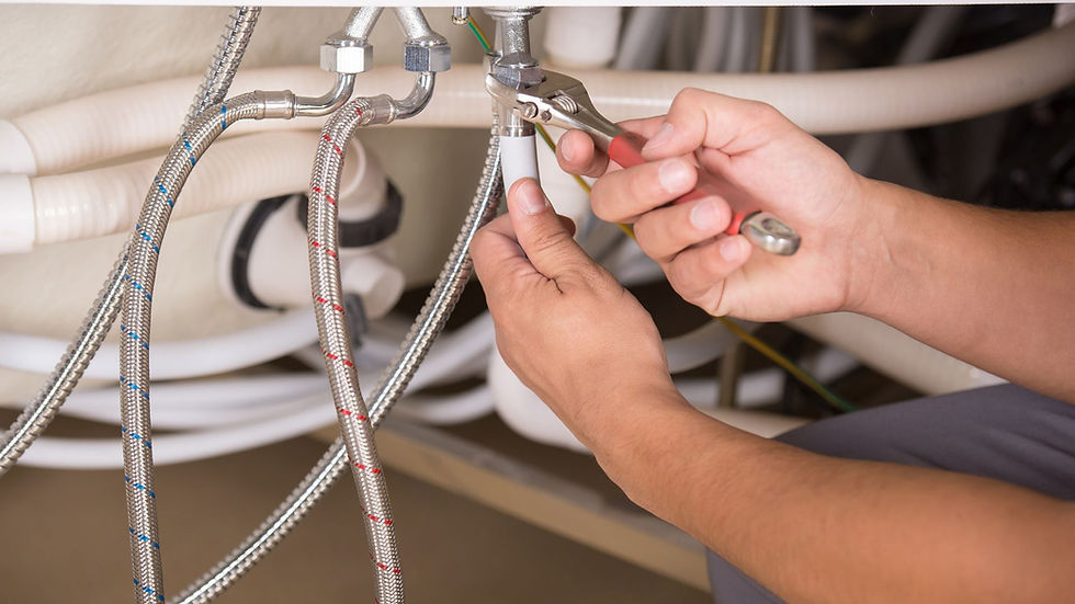 Plumbing contractor fixing a water leak