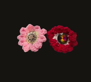 Pink and red crochet flowers with clear and amber colored rhinestones