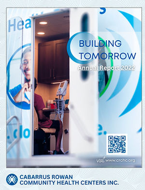 Front cover of 2022 CRCHC Annual Report, showing a patient sitting in the CRCHC medical mobile unit, seen through the open door of the unit.