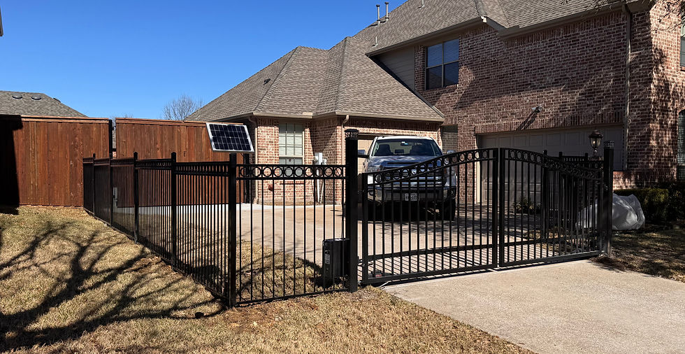 street view of a wrought iron fence and gate enclosing a front yard in Dallas-Fort Worth