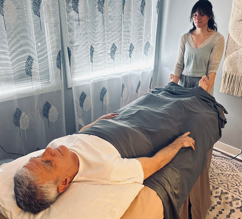 Taylor LoGrasso giving Craniosacral therapy at Cape Fear Acupuncture in Wilmington, NC