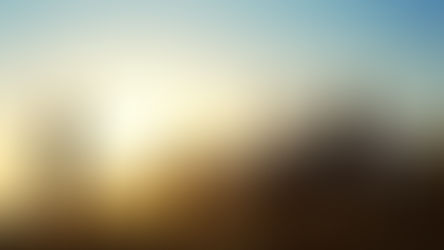 Playing soccer with a mountain and sunset in the backgroumd.