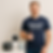 Smiling man wearing a “Smart Home Support Powered by Mindshift Mastery” t-shirt giving a thumbs-up while standing next to sma