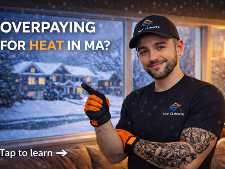 HVAC technician from Top Climate explaining energy-efficient heating solutions for Massachusetts homes during winter