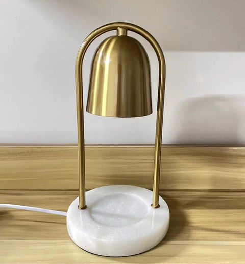 Luxury green marble electric candle warmer for flameless home fragrance.