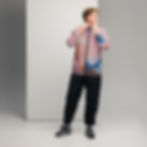 Model wearing a pink, zip-up windbreaker featuring an abstract wave print