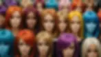 Eye-level view of vibrant hair colors displayed on a mannequin